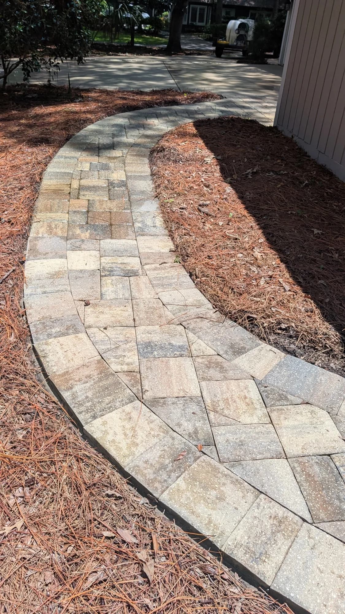 Soft washing equipment treating a Lowcountry home exterior