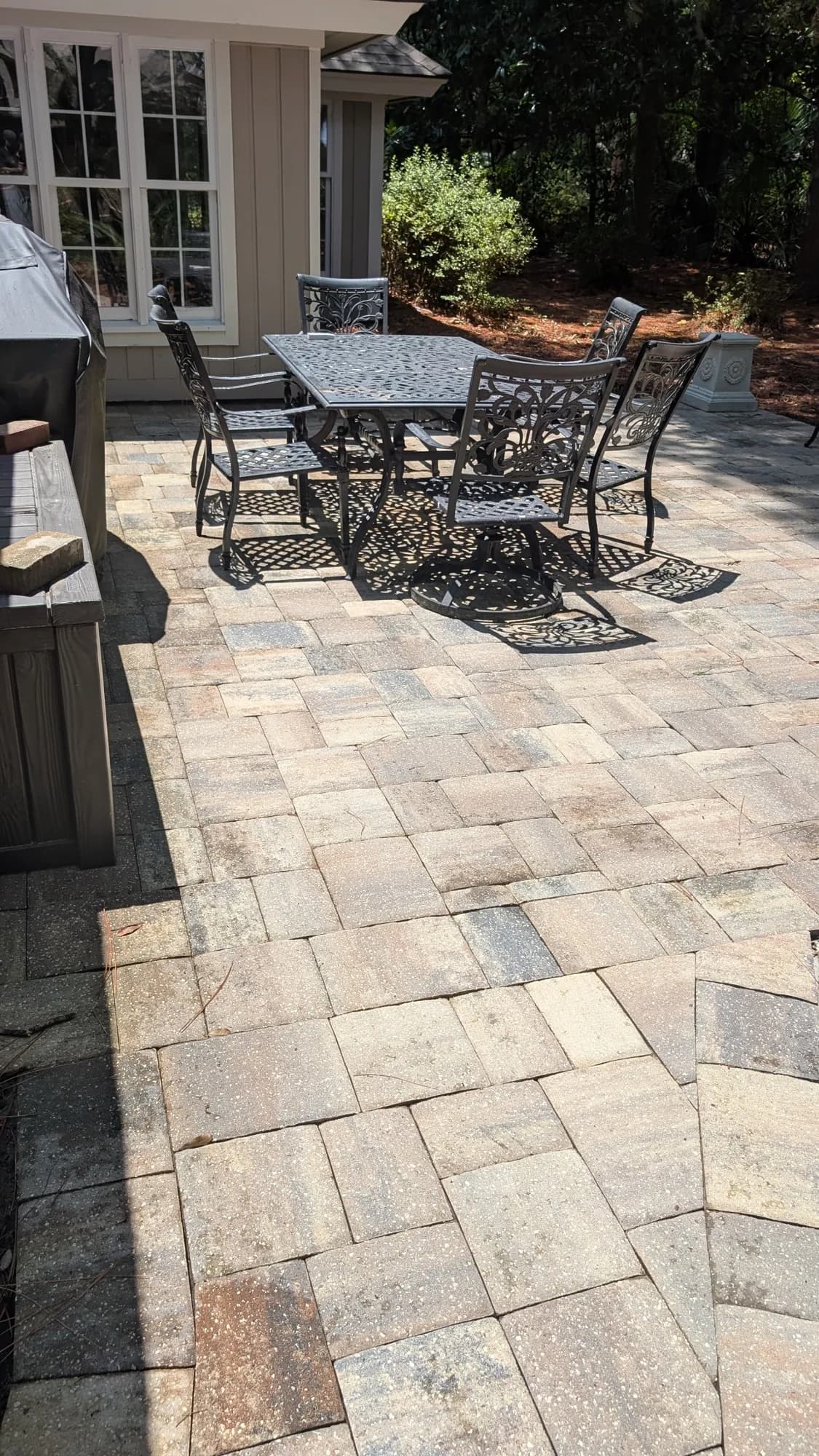 The same paver patio bright and clean after washing